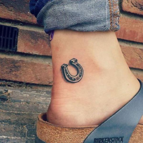 Small horseshoe ankle tattoo