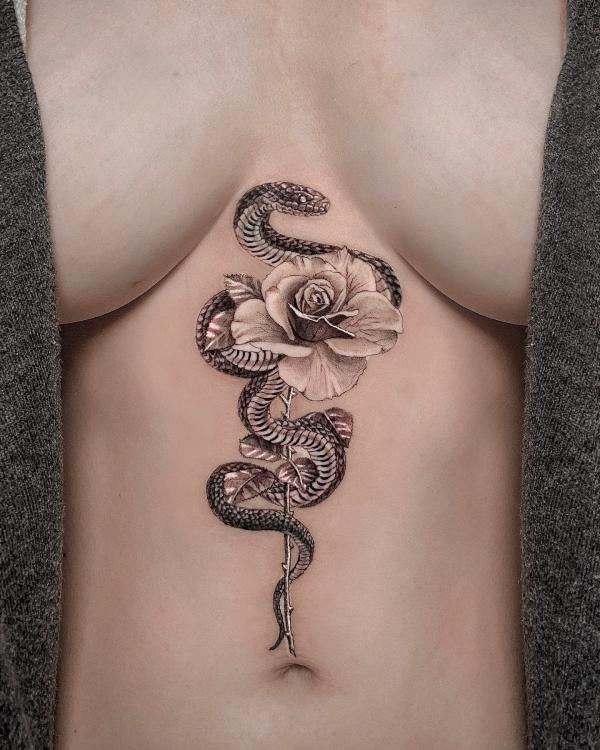 Snake and rose underboob tattoo