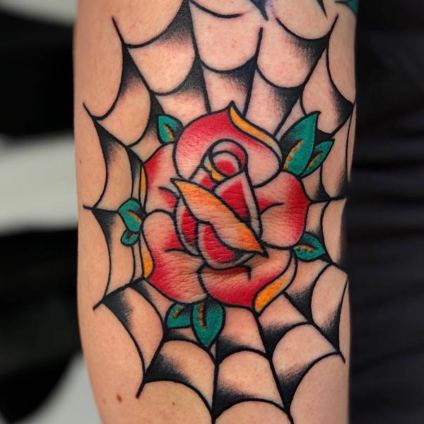 Spiderweb with rose flower tattoo traditional