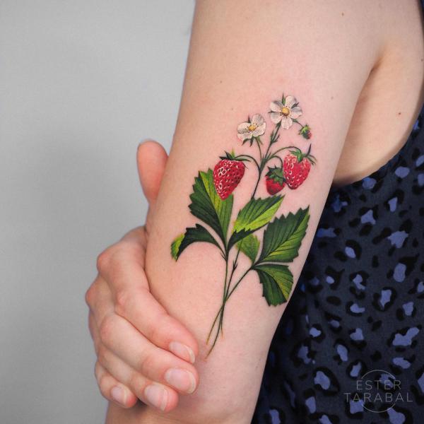 Strawberry back of arm tattoo