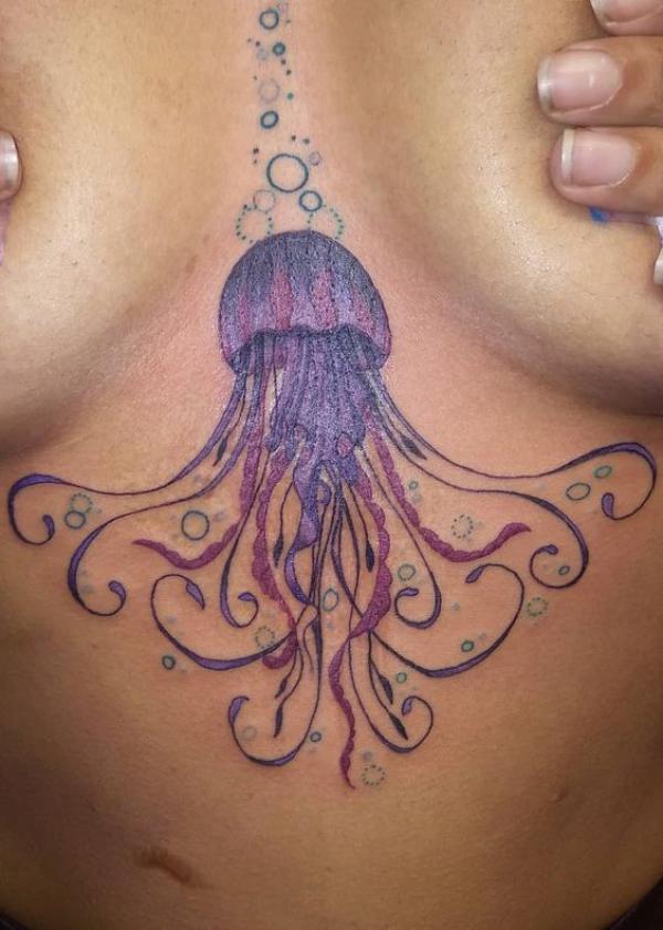 Stylish jellyfish sternum tattoo