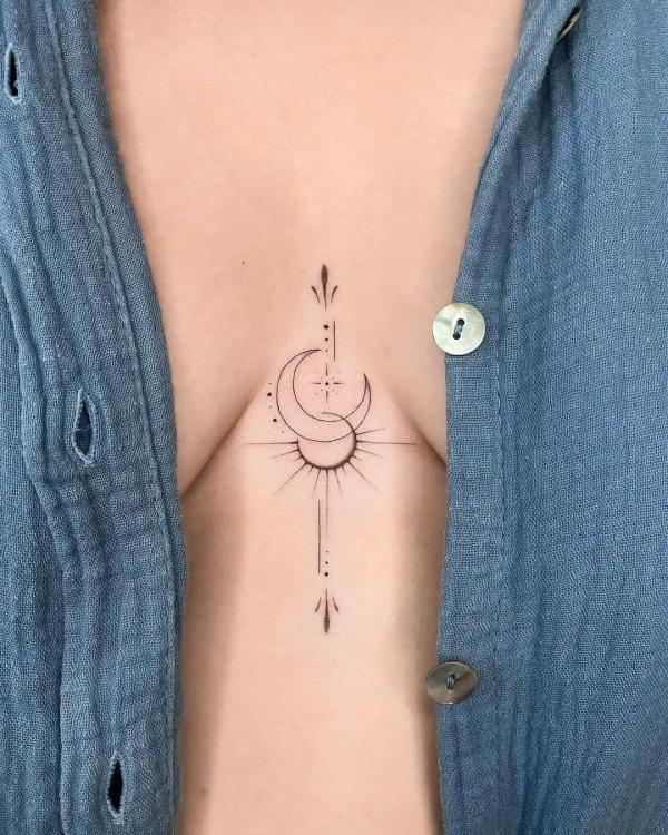 Sun and crescent moon sternum tattoo