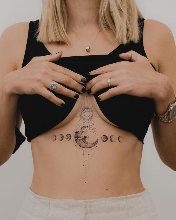 Sun and moon sternum tattoo