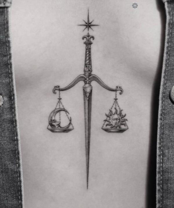 Sun and moon sword libra sternum tattoo