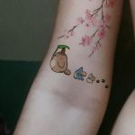 Three totoros walking with cherry blossom tattoo