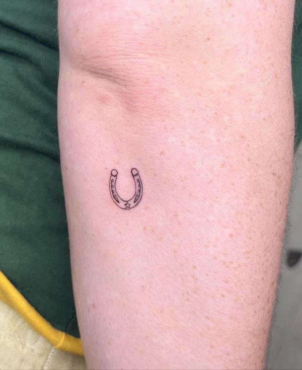Tiny horseshoe inner elbow tattoo