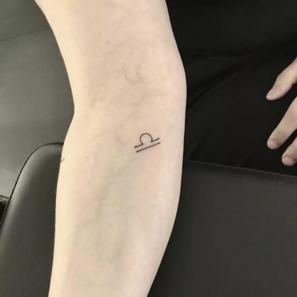 Tiny libra inner elbow tattoo