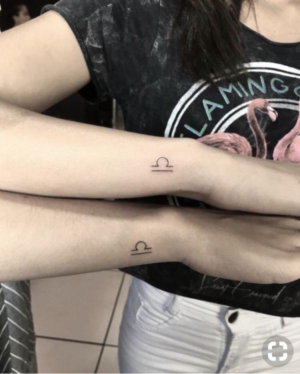 Tiny libra sign matching tattoo