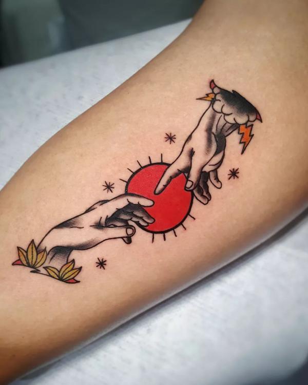 Traditional Adam hands and sun tattoo