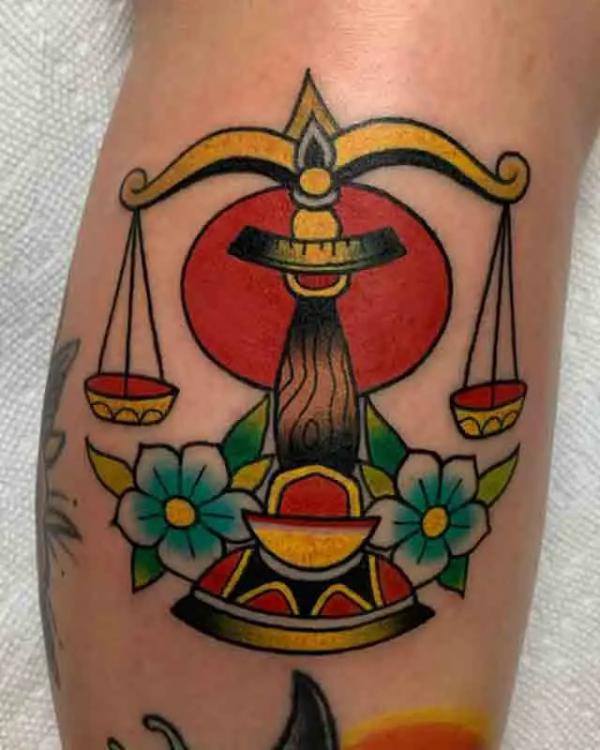 Traditional Libra with flower tattoo