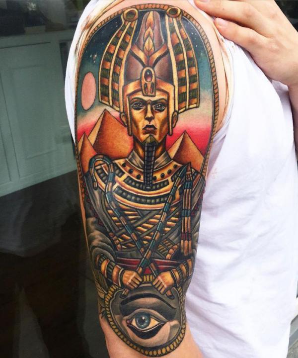 Traditional Osiris and eye tattoo