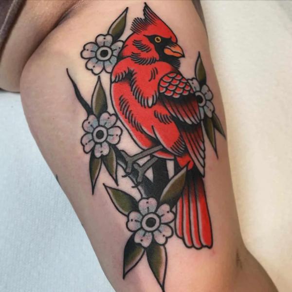 Traditional cardinal and dogwood flower tattoo