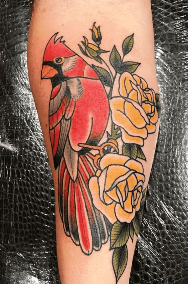Traditional cardinal and yellow rose tattoo