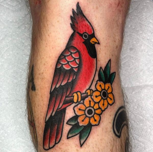 Traditional cardinal with Dogwood flower tattoo