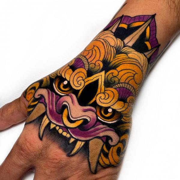 Traditional foo dog hand tattoo