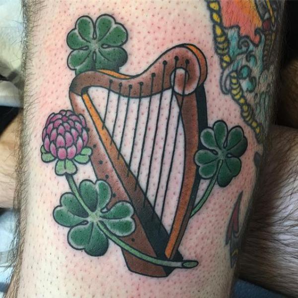 Traditional harp with clovers and thistle tattoo