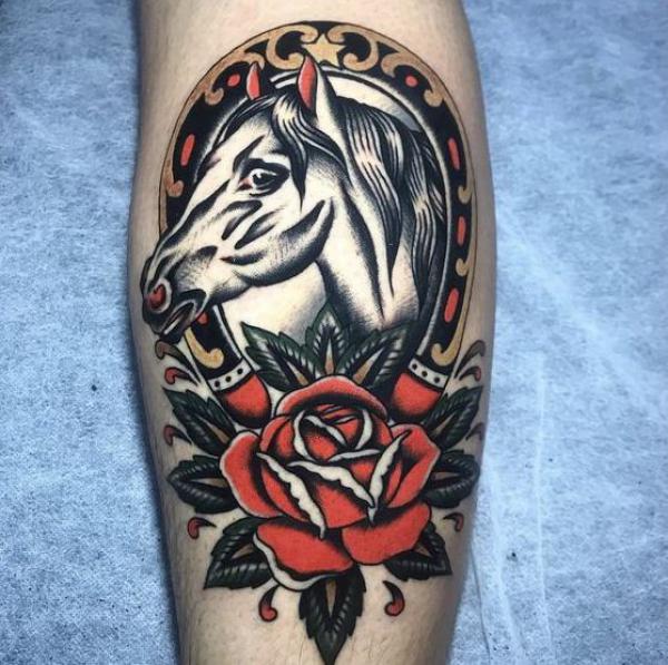 Traditional horse with horseshoe and rose tattoo