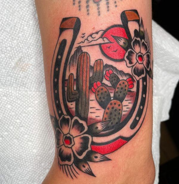 Traditional horseshoe and cactus tattoo