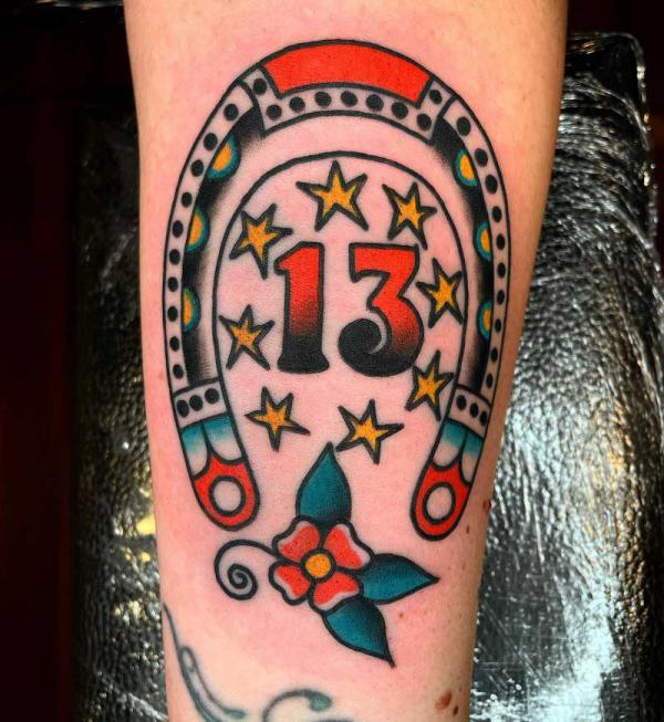 Traditional horseshoe with number 13 and stars tattoo
