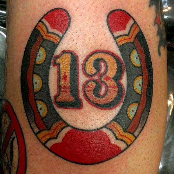 Traditional horseshoe with number 13 tattoo
