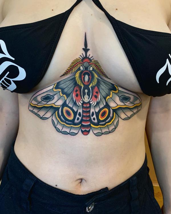 Traditional moth sternum tattoo