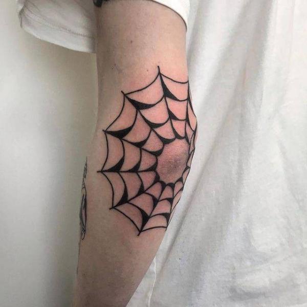 Traditional spider web elbow tattoo