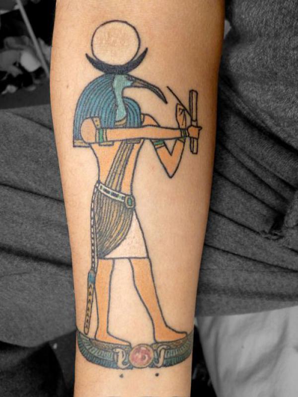 Traditional writing Thoth forearm tattoo