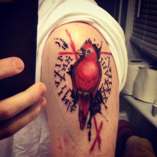 Trash polka cardinal shoulder tattoo