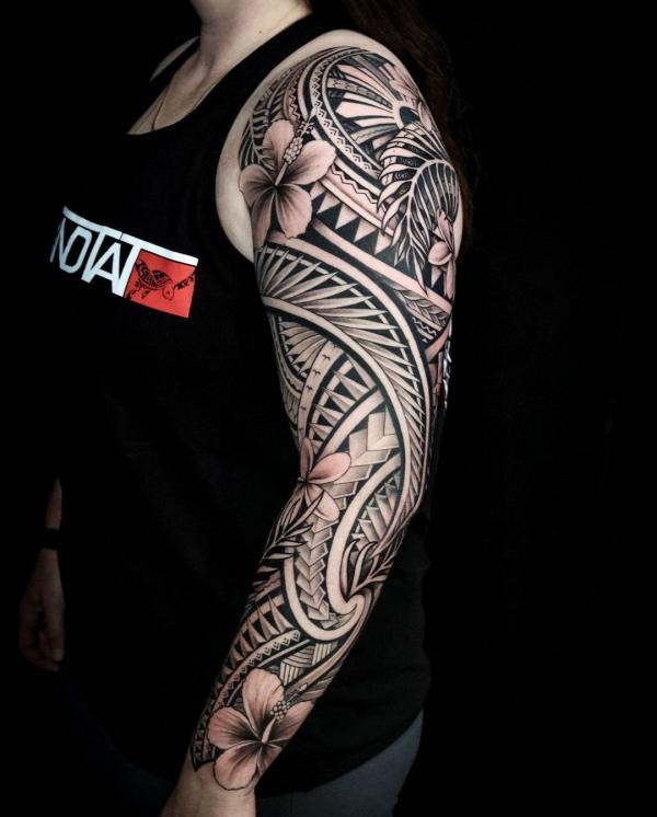 Tribal full sleeve with hibiscus tattoo