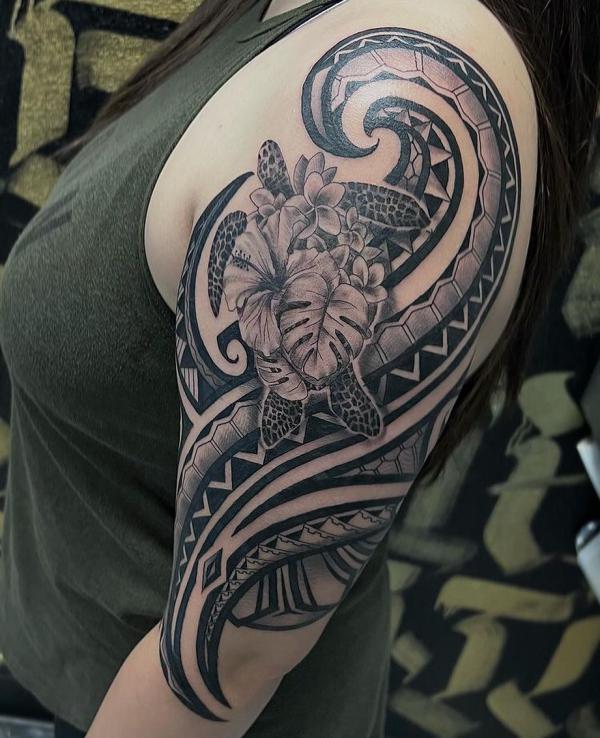Tribal half sleeve tattoo with a sea turtle