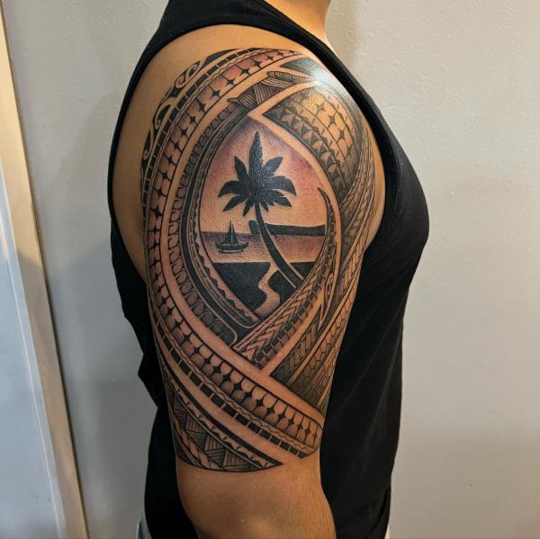 Tribal half sleeve with beach tattoo
