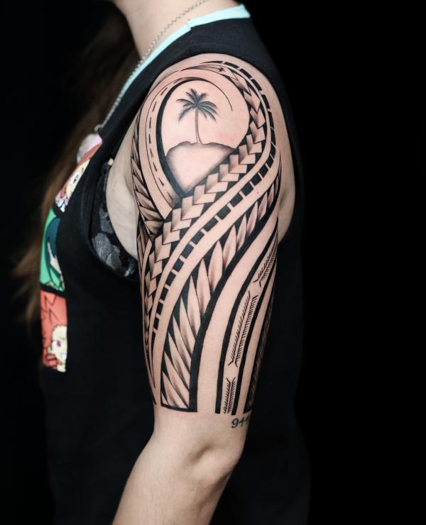 Tribal half sleeve with palm tree tattoo