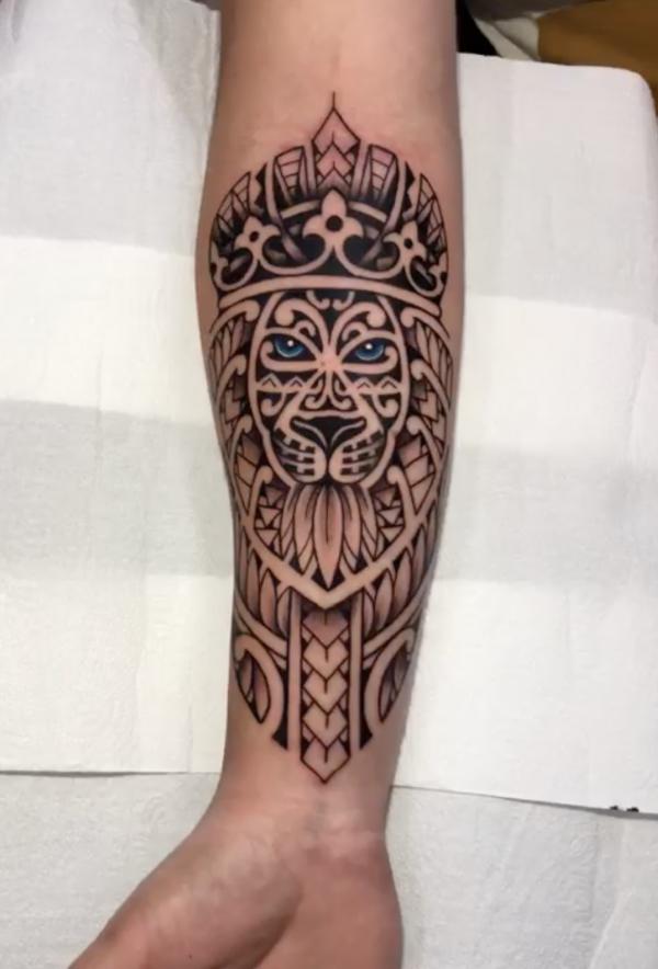 Tribal king forearm tattoo