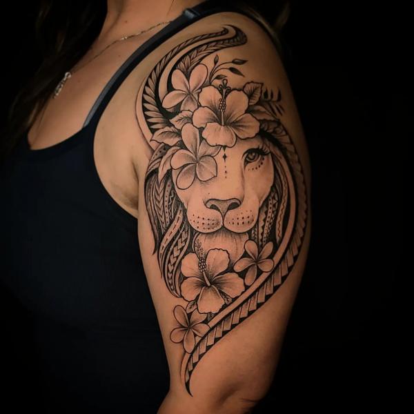 Tribal lion king with hibiscus half sleeve tattoo