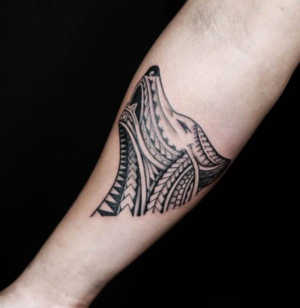 Tribal wolf head tattoo on sleeve