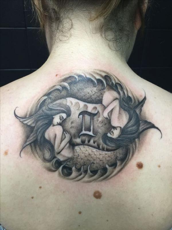 Twin mermaid with Gemini glyph tattoo