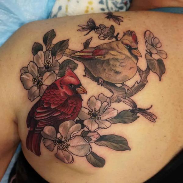 Two cardinal and dogwood flower shoulder blade tattoo