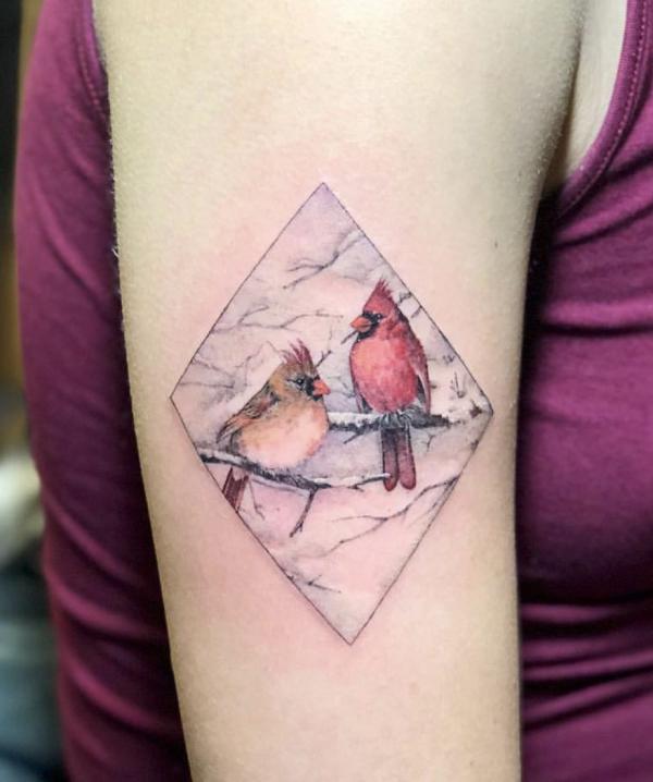 Two cardinals in snow tattoo