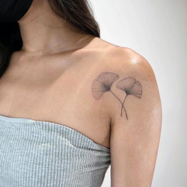 Two ginkgo leaf shoulder tattoo black and grey