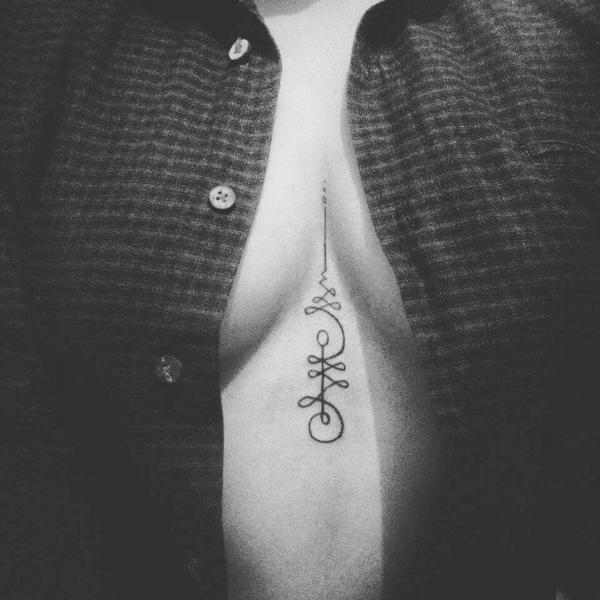 Unalome sternum tattoo