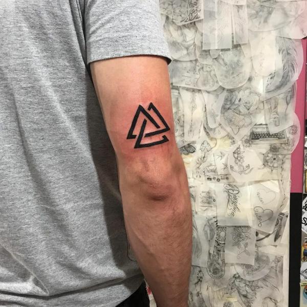 Valknut tattoo above the elbow
