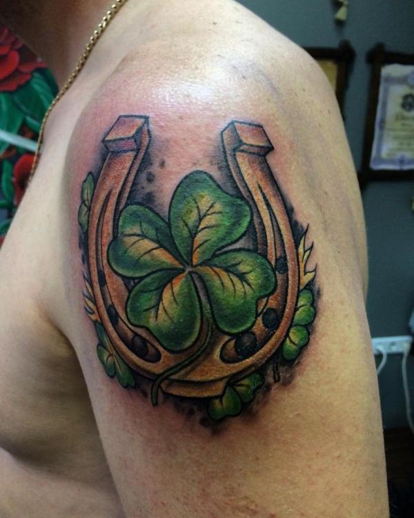 Vintage shamrock and horseshoe shoulder tattoo