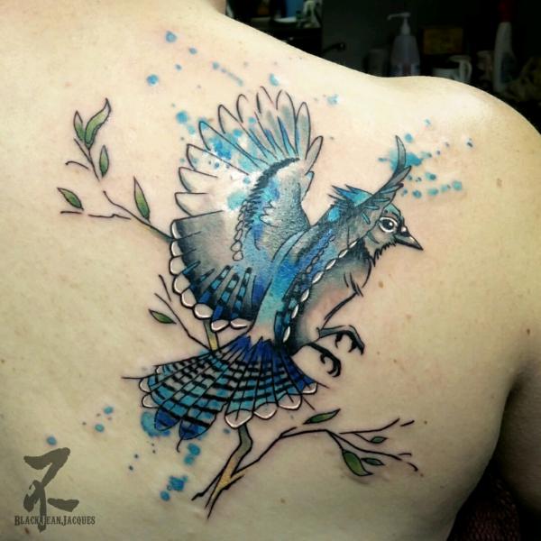 Watercolor blue jay flying off branch tattoo