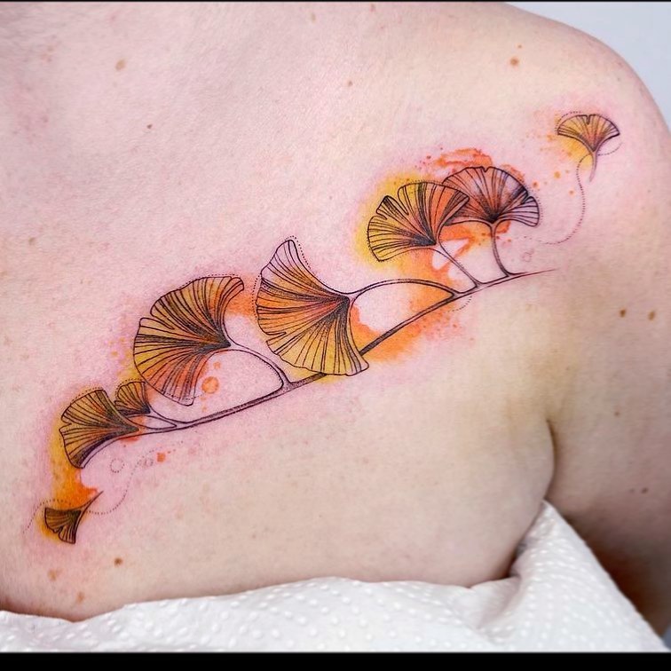 Watercolor branch of ginkgo chest tattoo