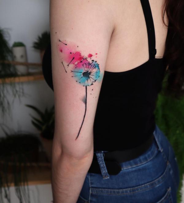 Watercolor dandelion back of arm tattoo