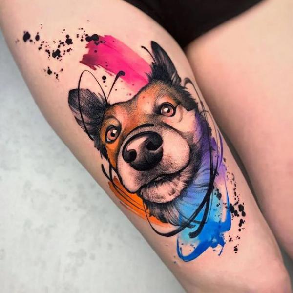 Watercolor dog above knee tattoo