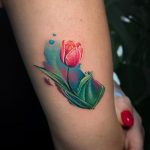 Watercolor tulip back of arm tattoo