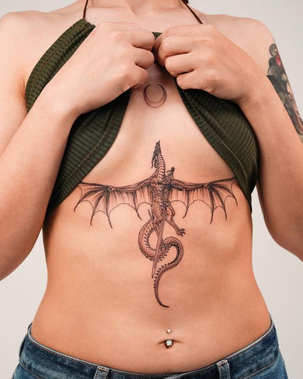 Western dragon with sword sternum tattoo
