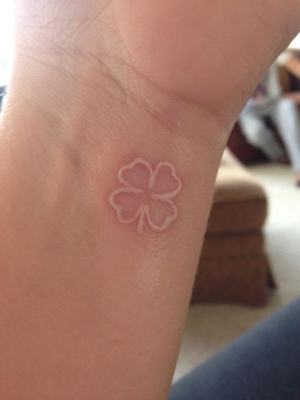White ink shamrock tattoo