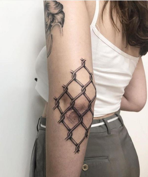 Wire mesh elbow tattoo